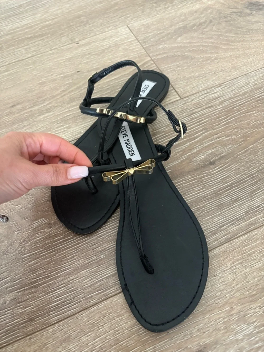 Steve Madden Black T-Strap Sandals with Gold Bow Accent